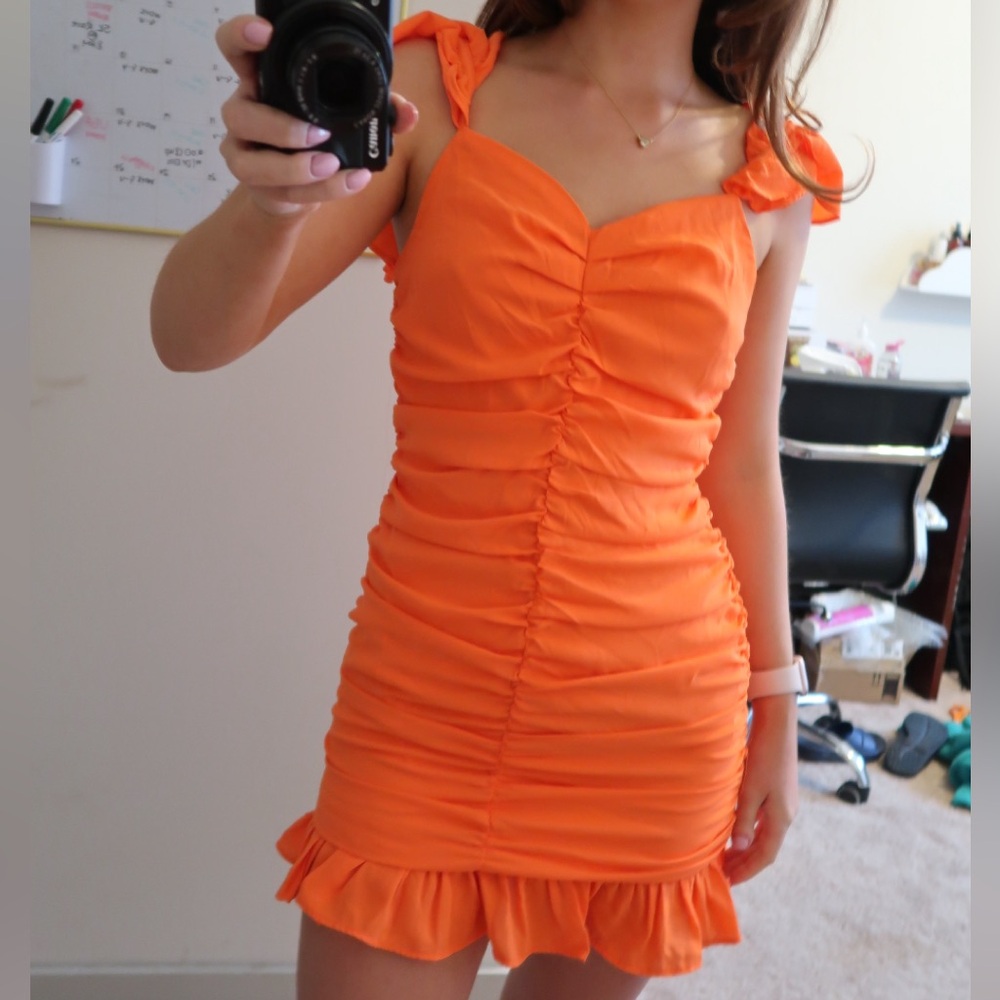 Orange ruffle mini dress